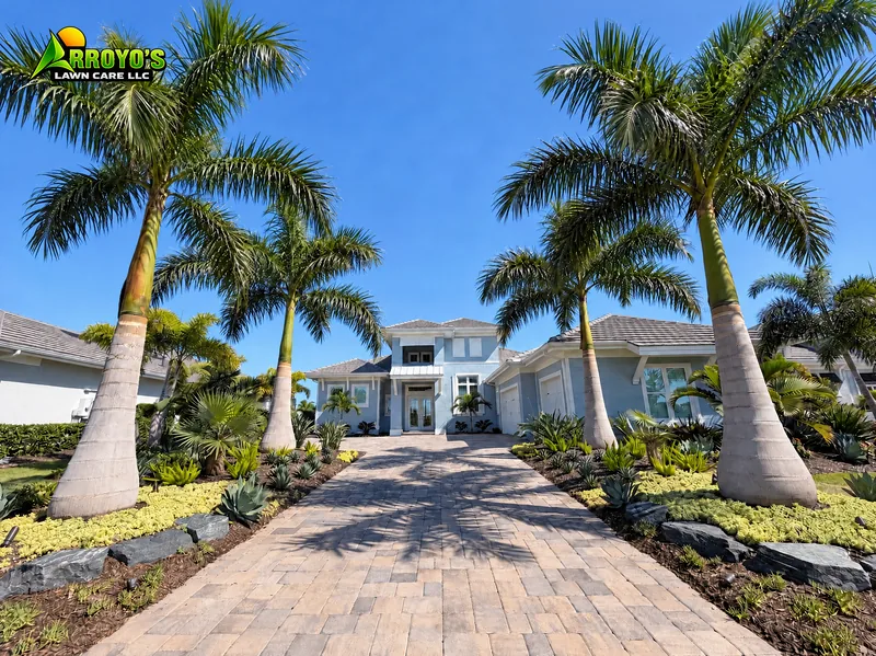 Royal palm entry: royal palms and planting beds